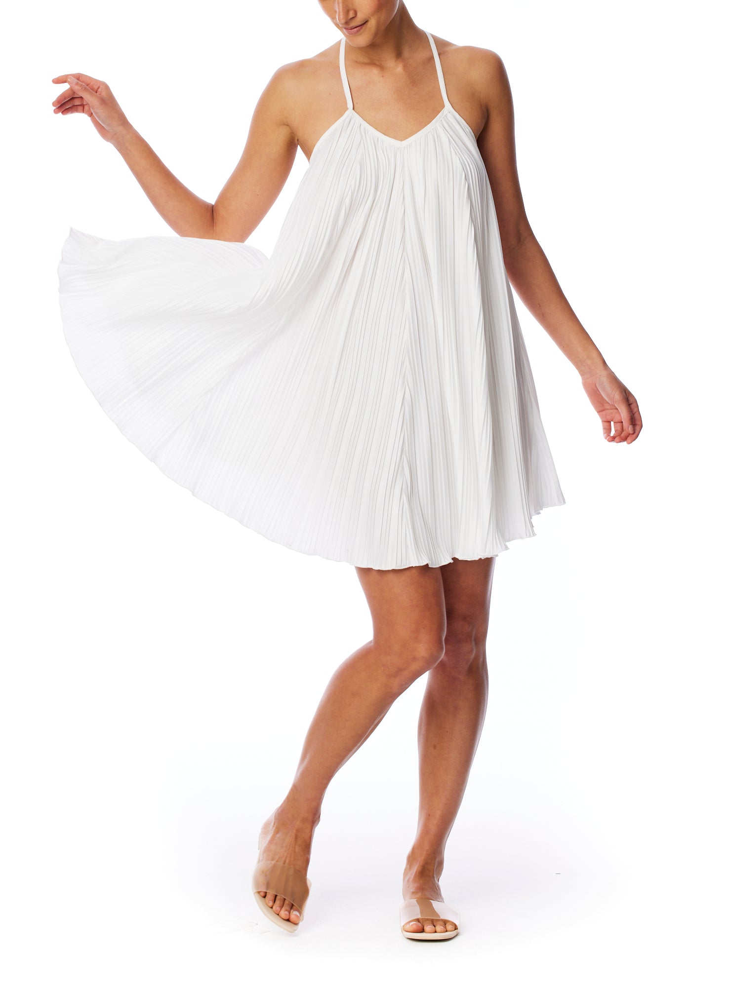 pleated dress with spaghetti straps, v-neck, trapeze cut and criss cross, open back in ivory