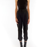 pleated pant with a tapered leg, elasticized cuffs, zip and button closure and side pockets