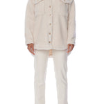 button up shacket in cuddly fabric featuring front pockets and shirt tail hem