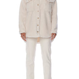 button up shacket in cuddly fabric featuring front pockets and shirt tail hem
