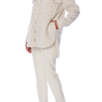 button up shacket in cuddly fabric featuring front and side pockets and shirt tail hem