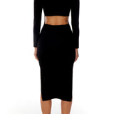 little black, open back dress featuring long sleeves, elegant crew neck and sexy side slit