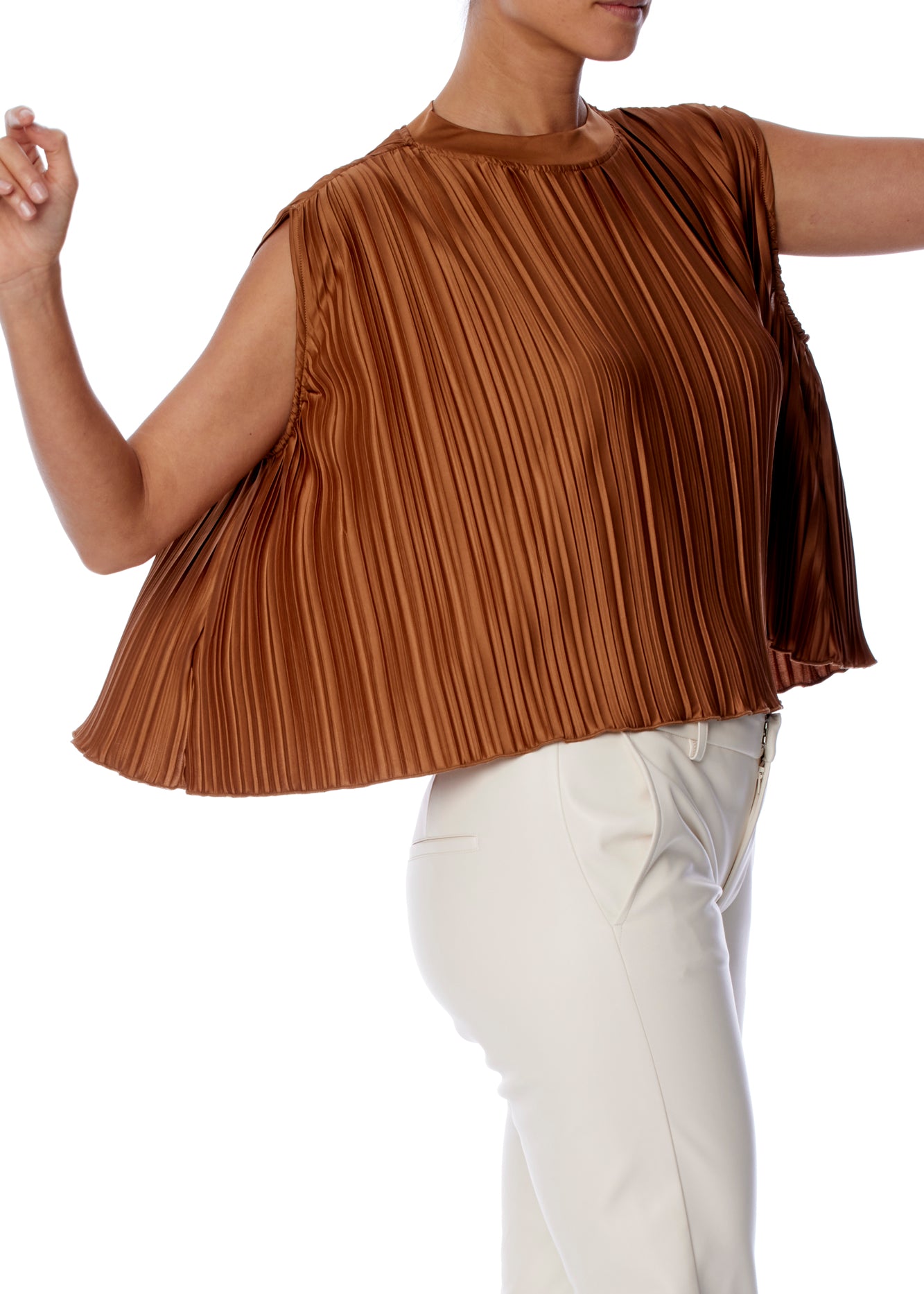 chic sleeveless, pleated cape top with a slight mock neck in rust