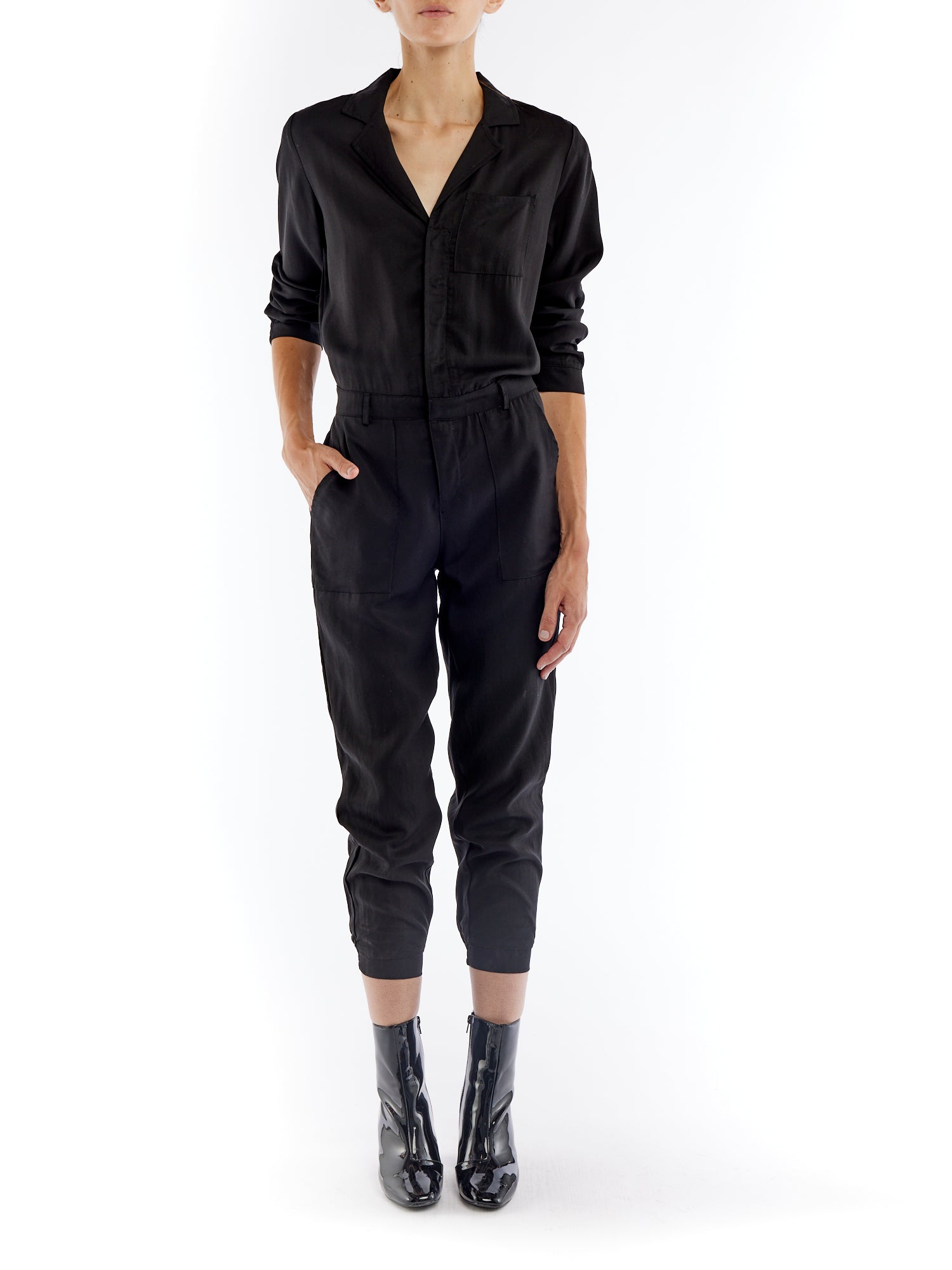 jumpsuit featuring a collared, button-front, long, cuffed sleeves, elasticized waist and bottom cuffs in black
